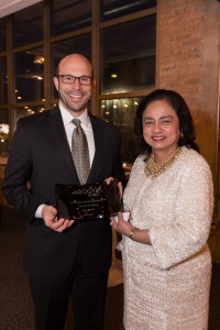 David Figliuzzi accepts honor on behalf of Cigna Foundation from Nalini Saligram, Founder and CEO of Arogya World.